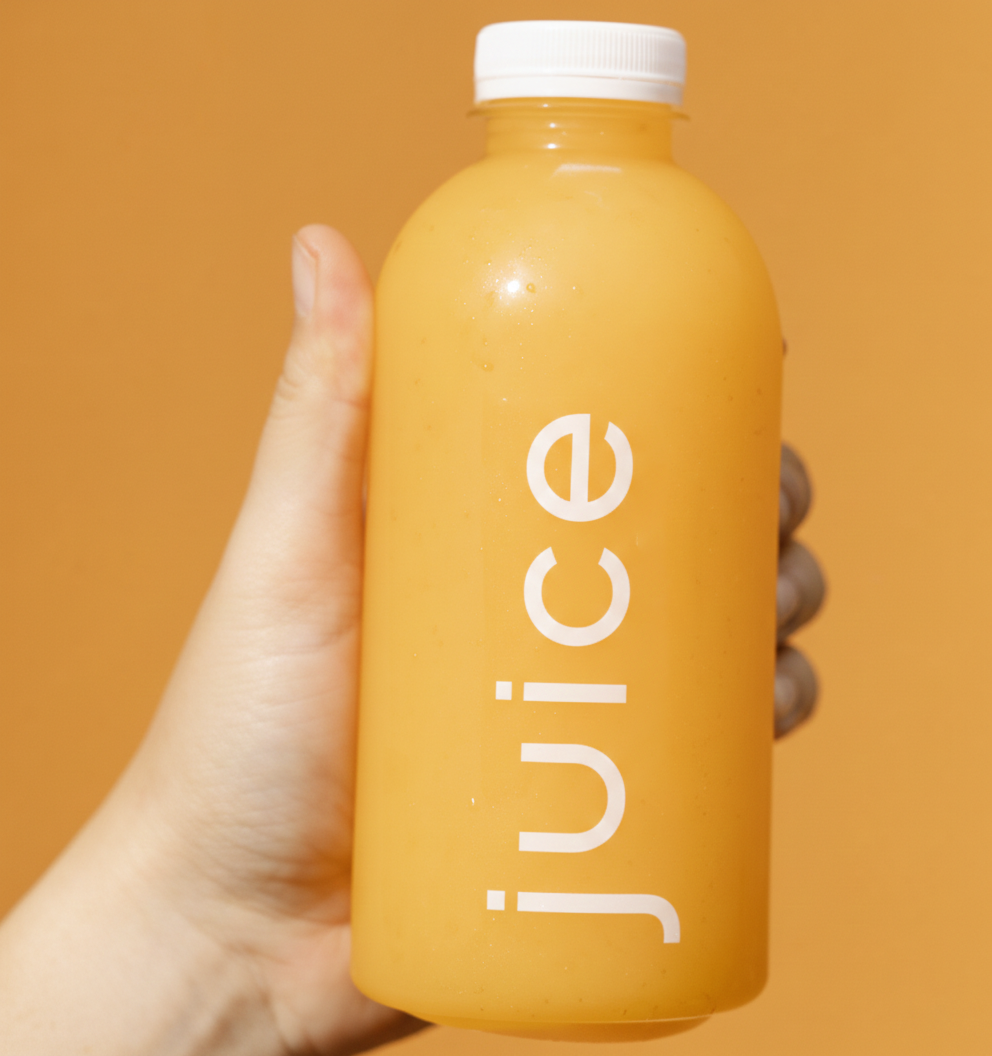 Clear PET plastic juice bottle representing safe food grade plastic packaging for beverages.