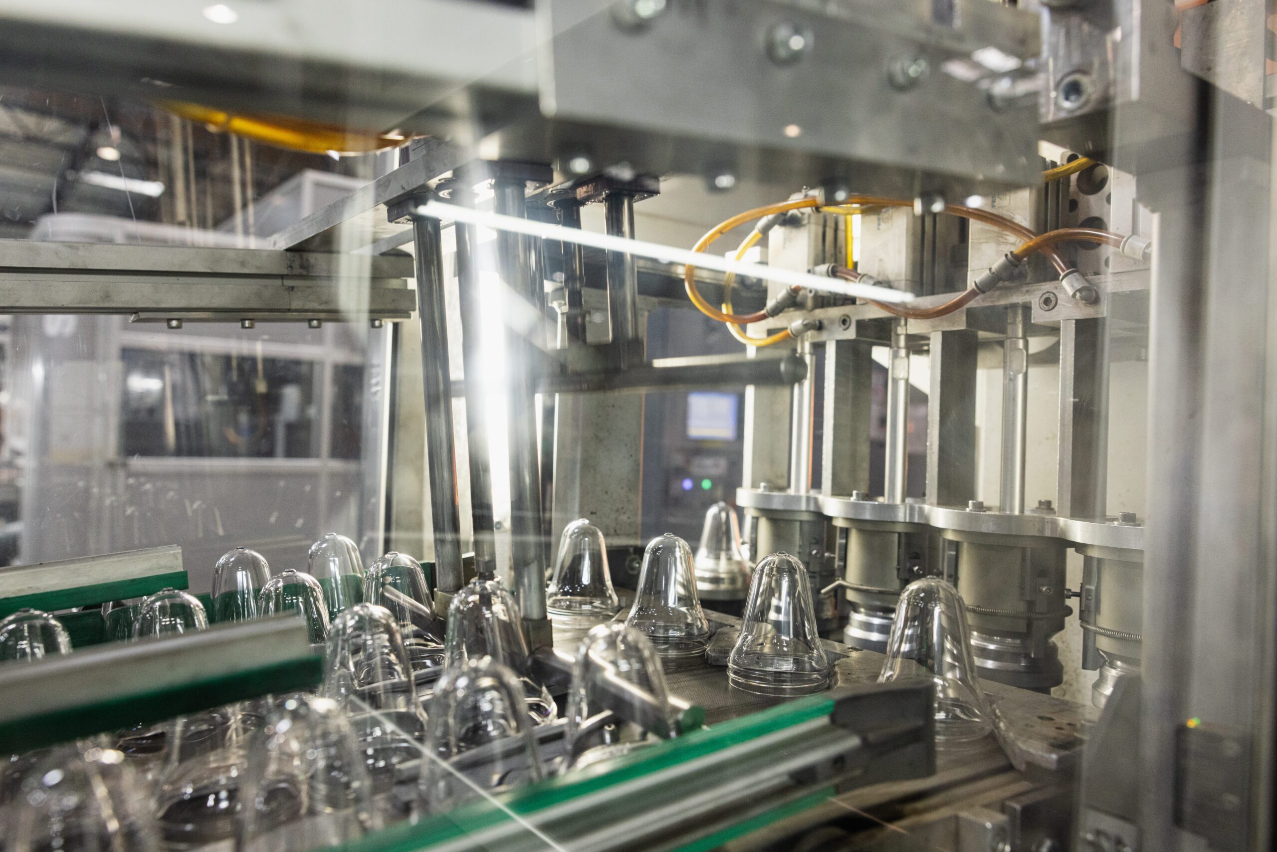 PET bottle blow molding production line at Plascene manufacturing facility in Oxnard California